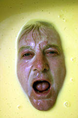 Councillor Alan Williams in a bath of custard