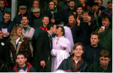 A football supporter and took his new bride to a match straight after the wedding!